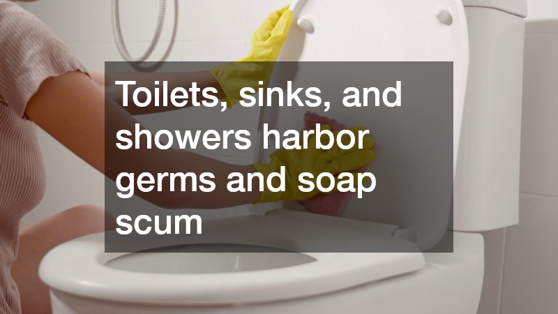 woman wearing yellow rubber gloves cleaning a toilet